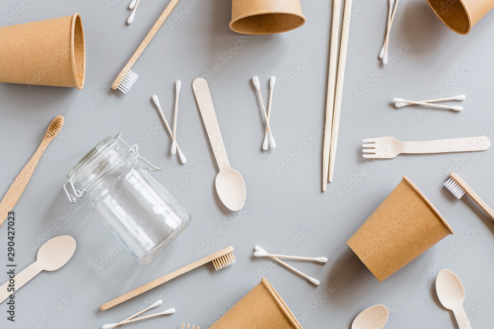 eco natural paper cups, straws, toothbrush flat lay on gray background. sustainable lifestyle concept. zero waste, plastic free items. stop plastic pollution. Top view, overhead, template, Mockup. eco natural paper cups, straws, toothbrush flat lay on gray background. sustainable lifestyle concept. zero waste, plastic free items. stop plastic pollution. Top view, overhead, template, Mockup.