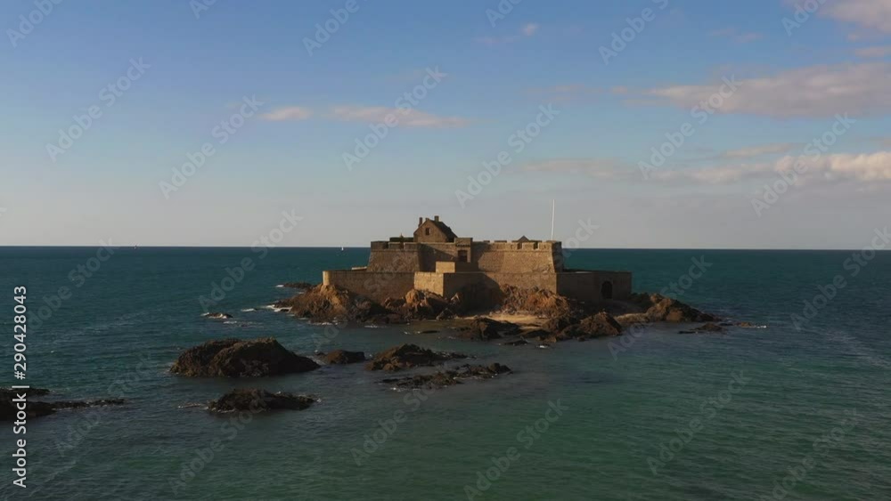 An aerial shot of an old fortress built right off the coast of St. Malo, France. Shot in 4K 24fps. An aerial shot of an old fortress built right off the coast of St. Malo, France. Shot in 4K 24fps.