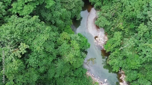 Beautiful Drone Shot Of A River In The Middle Of The Tropical Rain Pacific Forest Located In Colombia. photo