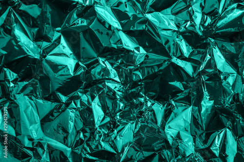 Fotografi Mint green deformed cellophane or plastic