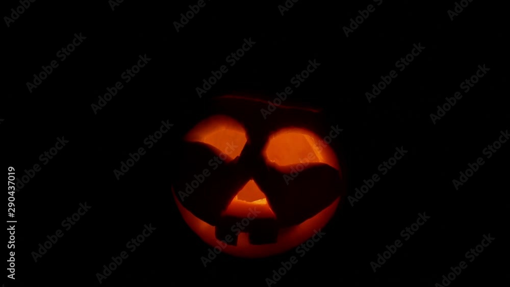 Halloween carved pumpkins burn eyes. Black background. Halloween carved pumpkins burn eyes. Black background.