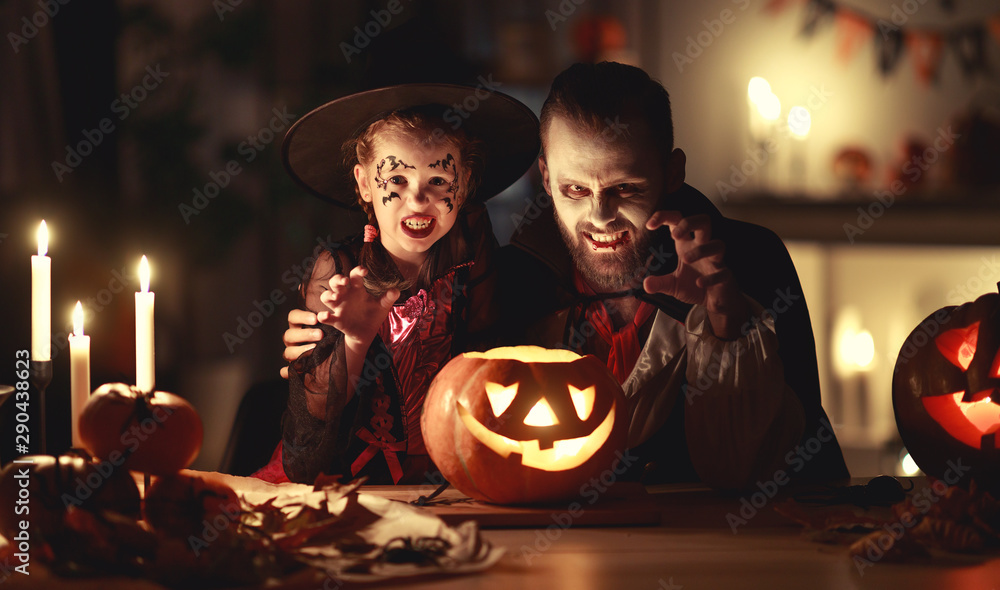 happy family   father and child daughter in costumes and makeup on  Halloween - obrazy, fototapety, plakaty 