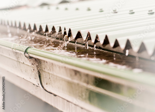 Rain on a corrugated iron roof collecting in a gutter