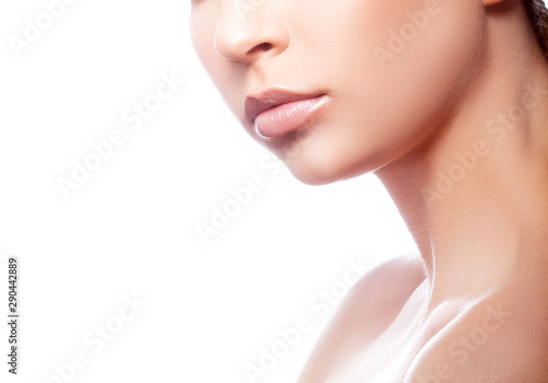 Lips, hand, part of beauty face, shoulder of young woman with perfect skin. Skincare facial treatment concept