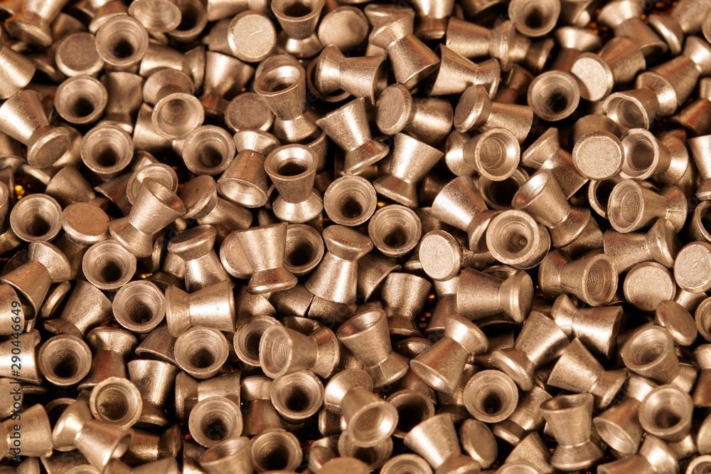 golden lead air-gun pellets close-up background texture, selection of pellets of an Air rifle. Close up. gun control background. Concept of shooting, pneumatic weapon, Air rifle parts and copy space. golden lead air-gun pellets close-up background texture, selection of pellets of an Air rifle. Close up. gun control background. Concept of shooting, pneumatic weapon, Air rifle parts and copy space.