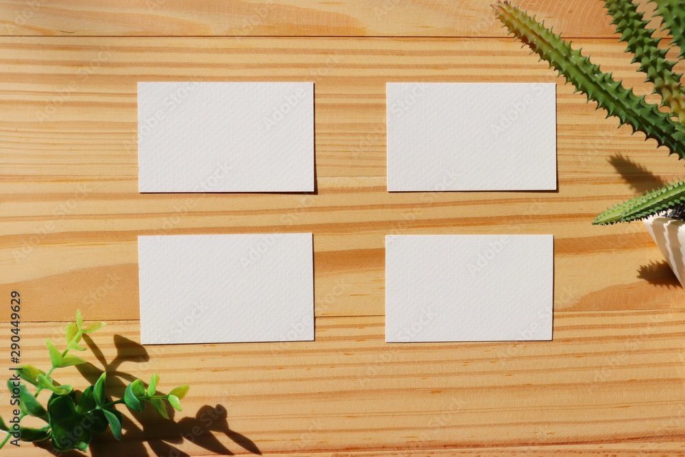 blank white paper on wood background. business card with rustic style. blank white paper on wood background. business card with rustic style.