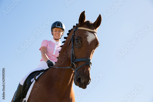 Young Woman Riding Horse