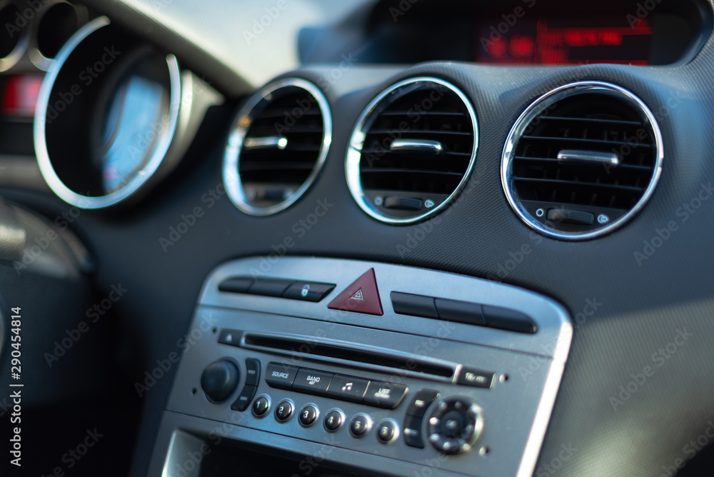 Interior of a car. Car dashboard with buttons and CD player. Interior of a car. Car dashboard with buttons and CD player.
