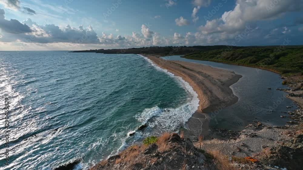 Video with panoramic morning view with one of the most beautiful and wild beaches at the Black Sea coast and the estuary of Veleka river, Bulgaria. Video with panoramic morning view with one of the most beautiful and wild beaches at the Black Sea coast and the estuary of Veleka river, Bulgaria.