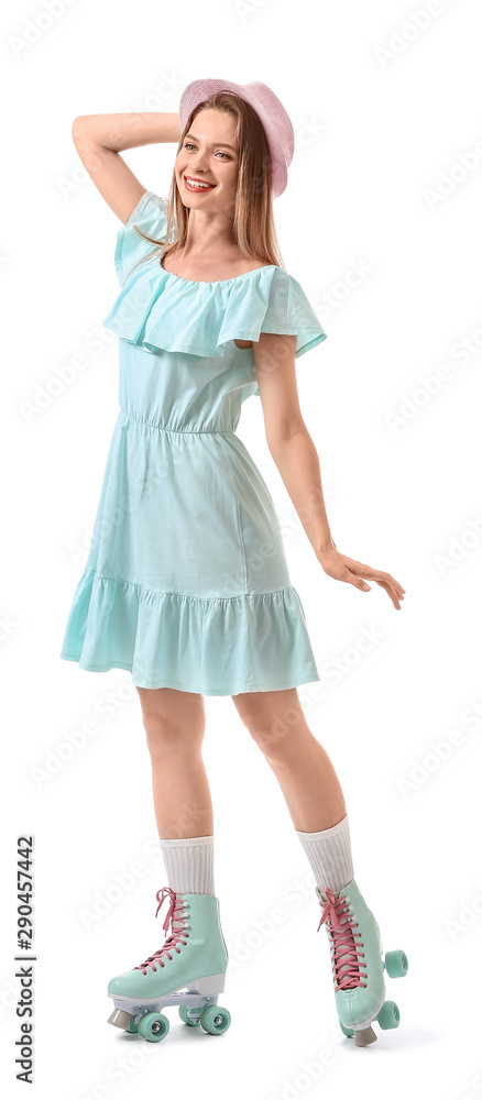 Beautiful young woman on roller skates against white background Beautiful young woman on roller skates against white background