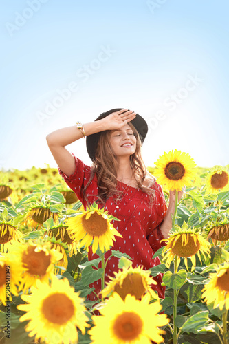 Beautiful young woman in su...