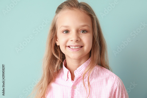 Portrait of happy little gi...