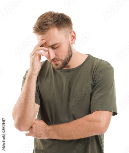 Stressed young man on white...