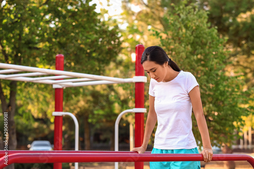 Sporty Asian woman training...