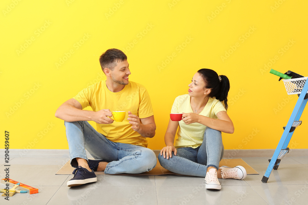Happy couple resting during repair in their new house Happy couple resting during repair in their new house