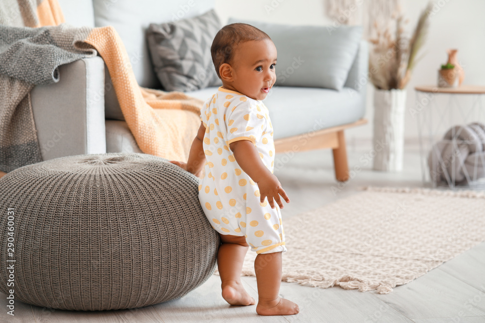 Cute little baby learning to walk at home - obrazy, fototapety, plakaty 