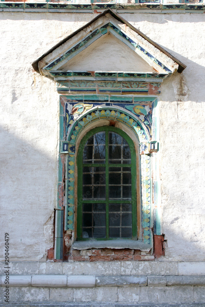 Photo of a window on an old white stone house