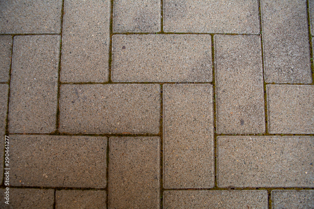 Fototapeta premium Old red brick wall. Old concrete wall. The facade of the house built of solid stone cement