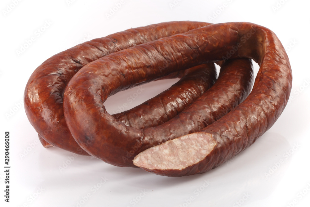 Dry sausage. Traditional sausage on a white background. Dry sausage. Traditional sausage on a white background.