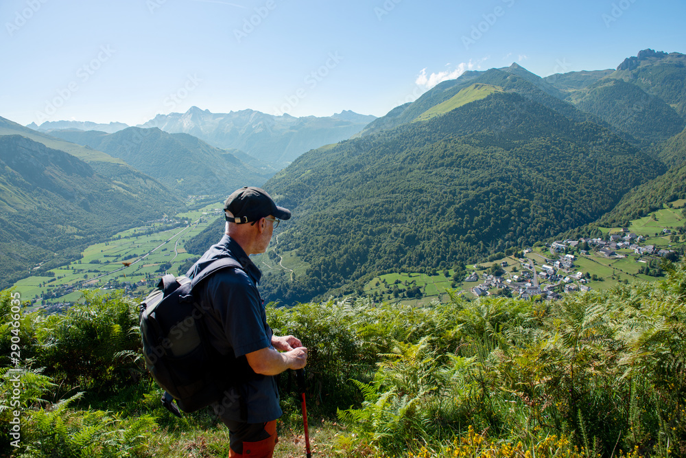 man with backpack hiking in Pyrenees Mountains ( plateau du Benou)