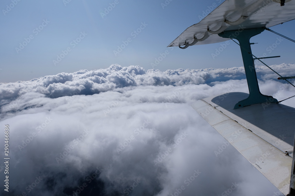 Fototapeta premium The view from opened door of an airplane.