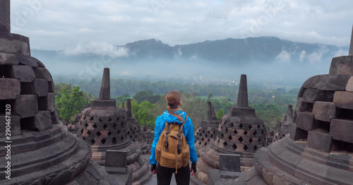Tourist backpacker exploring the Borobudur temple in Java island,Indonesia photo