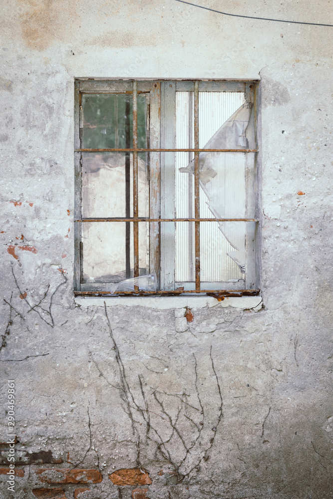 Old brocken glass window, old building with stone background, old window in the wall, isolated for  a texture, old window in the wall