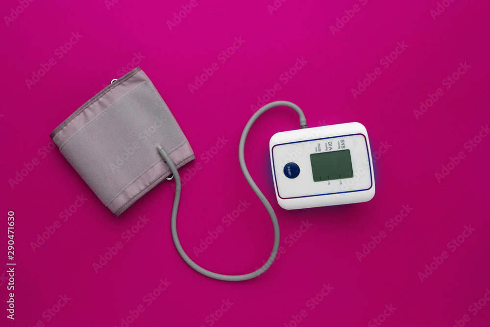 new modern digital tonometer silated, top view with copy space on color backgrounds new modern digital tonometer silated, top view with copy space on color backgrounds
