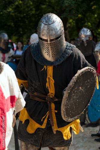 Medieval knight in the arena. Medieval knight prepare to battle at the festival of medieval culture.