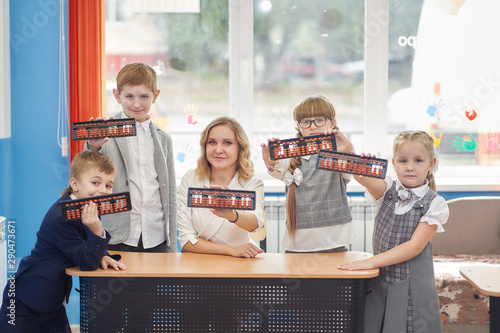 teacher and students in classroom  with abacus soroban