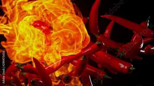 Super Slow Motion Shot of Red Chilli Peppers and fire at 1000fps. Shooted with High Speed Cinema at 4K. photo