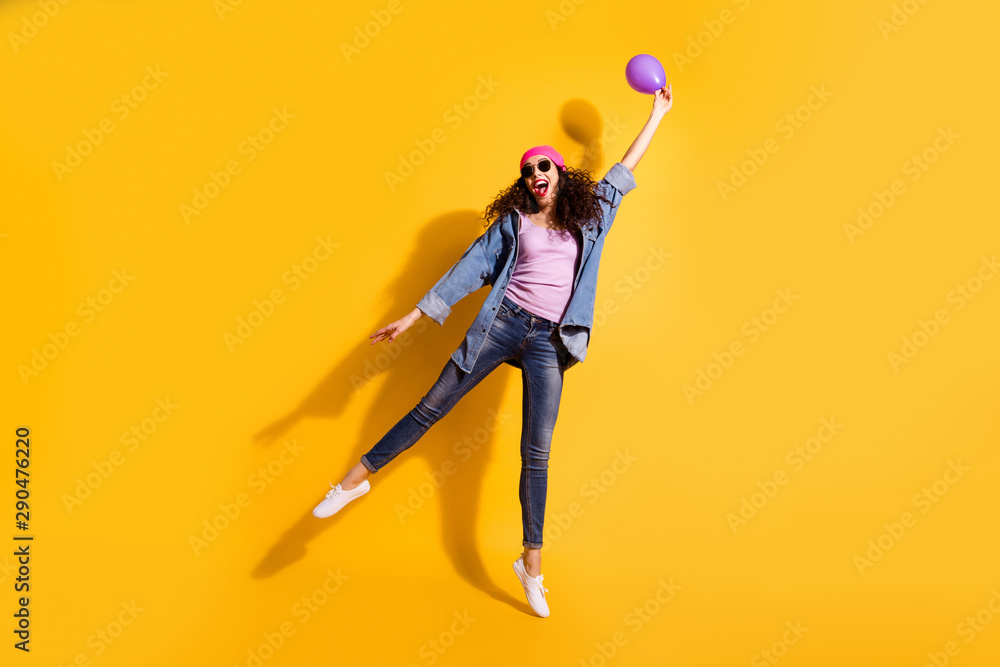 Full length photo of nice wavy lady holding air balloon in hand begin to raise up wear casual trendy clothes isolated yellow color background