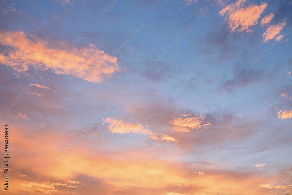 Orange sky background with clouds