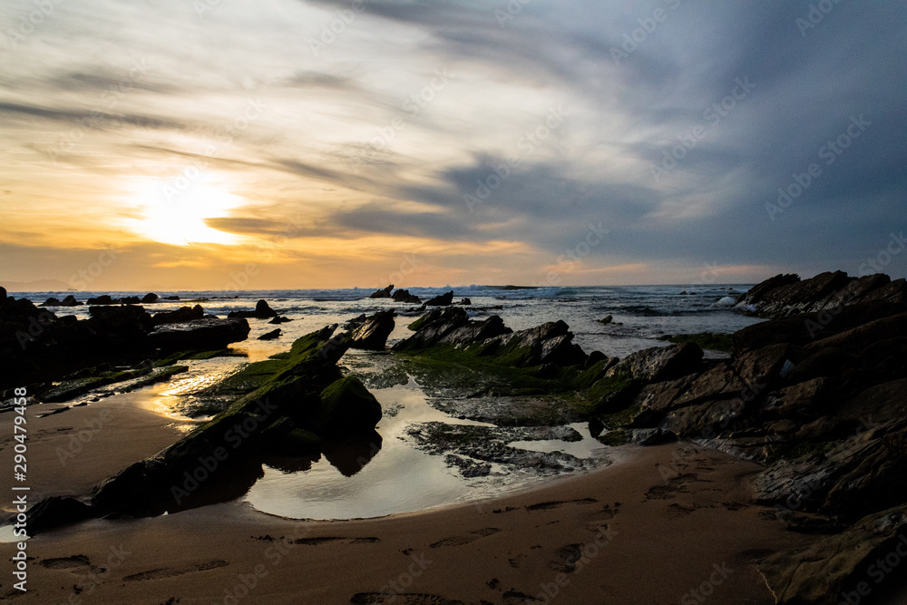 sunset at Barrika beach next to the rocks sunset at Barrika beach next to the rocks
