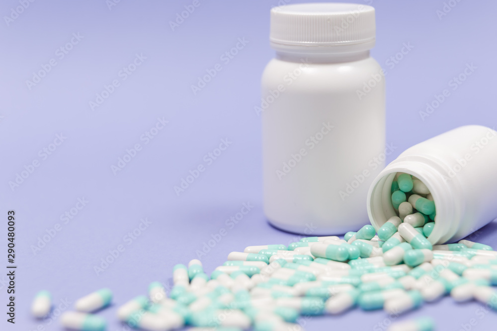 Pills spilling out of pill bottle. Pharmaceutical industry. Pharmacy. Pills spilling out of pill bottle. Pharmaceutical industry. Pharmacy.