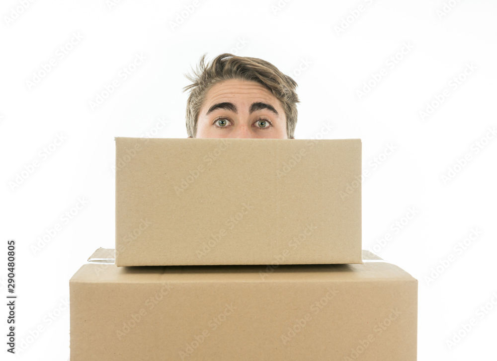 Boy carrying boxes of cardboard Boy carrying boxes of cardboard
