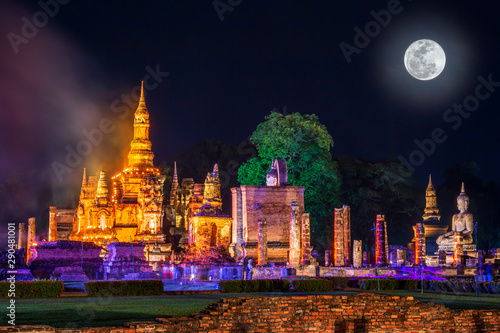 Beautiful scene light color Sukhothai Co Lamplighter Loy Kratong Festival party at The Sukhothai Historical temple park covers the ruins of Sukhothai, in what is now Northern Thailand. With full moon