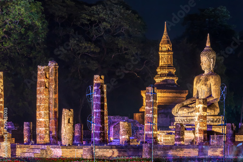 Beautiful scene light color Sukhothai Co Lamplighter Loy Kratong Festival party at The Sukhothai Historical temple park covers the ruins of Sukhothai, in what is now Northern Thailand. With full moon photo