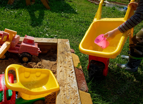 children's sandbox with toys in the village, Russia.