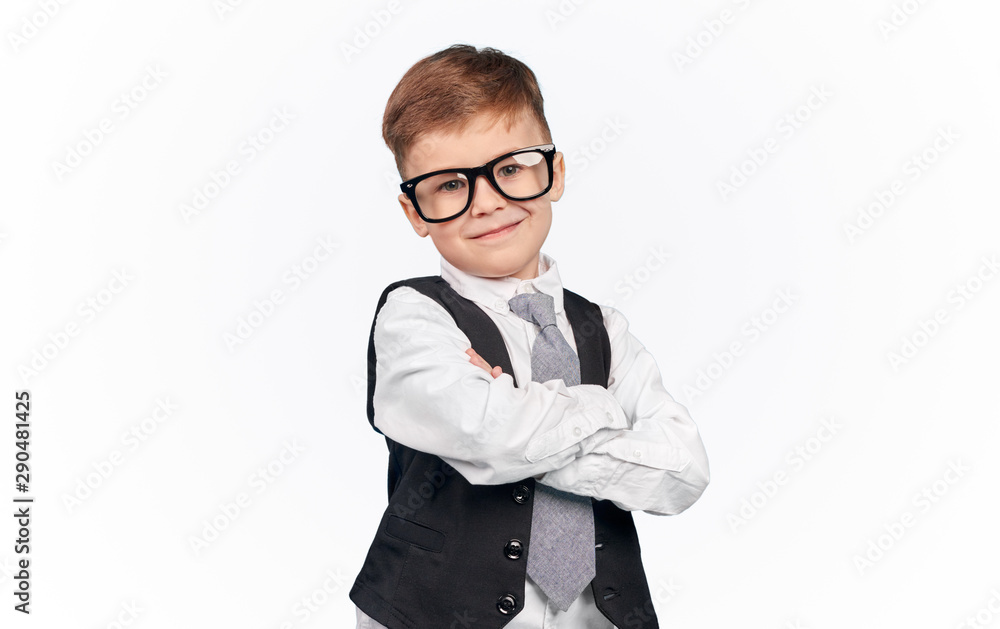 Nerdy confident schoolboy in glasses smiling Nerdy confident schoolboy in glasses smiling
