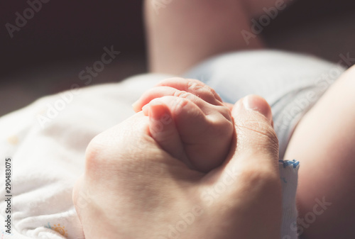 newborn baby hands holding
