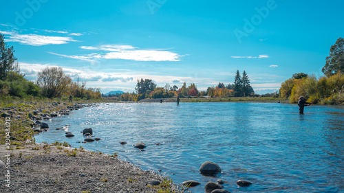 Outdoor lifestyle, recreation, fly fishing technique for Trout by fisherman who fishing in Tongariro River in North Island of New Zealand.