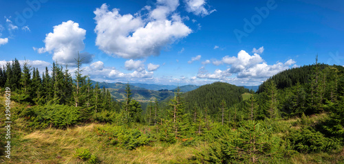 Summer landscape in mountains and blue sky with clouds