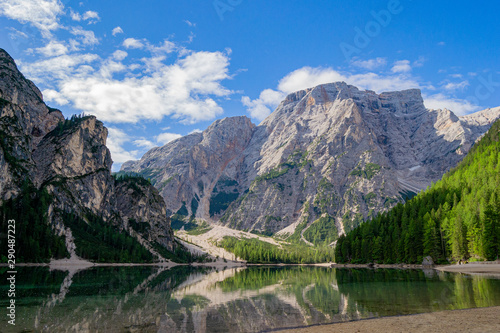 mountains that are reflected on Lake Braies in the midst of nature