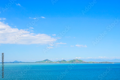 The sea with blue sky and white clouds