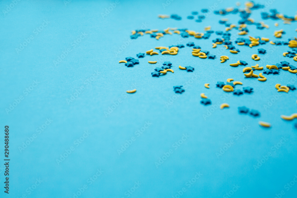 Fototapeta premium topping in the form of the moon and stars on a blue boom
