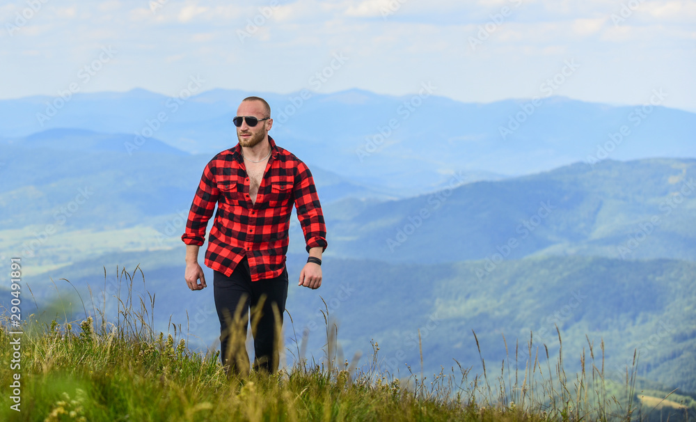Tourist walking mountain hill. Power of nature. Man stand on top of mountain landscape background. Hiking concept. Discover world. Masculinity and male energy. Natural power. Masculine power