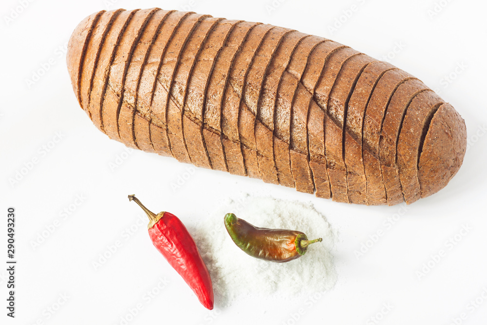 Rye bread with red chili peppers and salt on a white background isolated. Rye bread with red chili peppers and salt on a white background isolated.