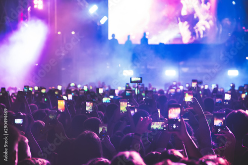 People taking photographs with touch smart phone during a music entertainment public concert © ververidis