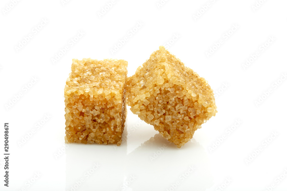 two cubes of brown cane sugar isolated on white background two cubes of brown cane sugar isolated on white background